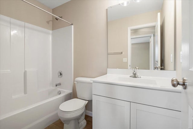 full bath with shower / tub combination, vanity, and toilet