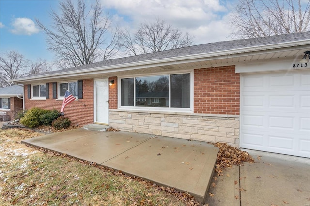 single story home with stone siding, brick siding, and roof with shingles