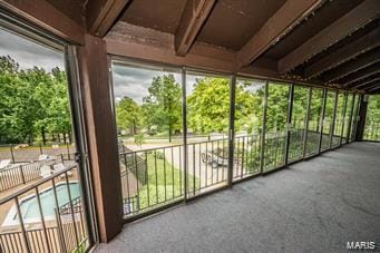 unfurnished sunroom featuring a healthy amount of sunlight