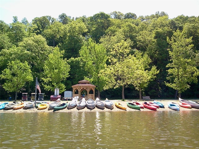 view of community featuring a water view and a gazebo