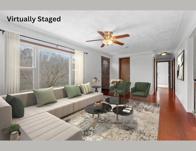 living room with baseboards, ceiling fan, and hardwood / wood-style floors