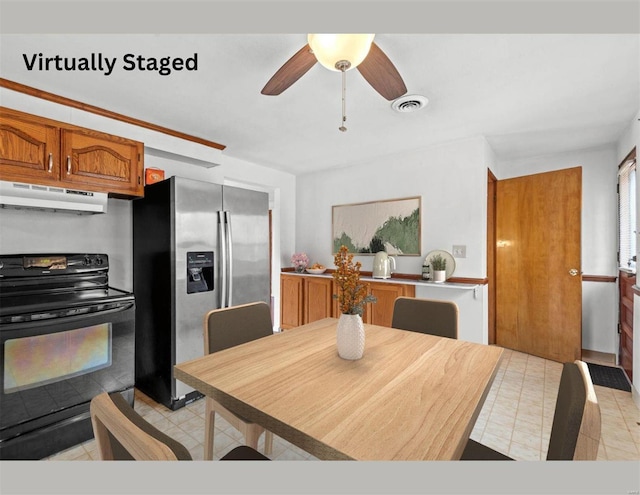 dining space with light tile patterned floors, visible vents, and a ceiling fan