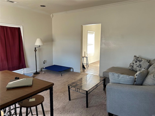 living area featuring baseboards, visible vents, ornamental molding, tile patterned floors, and carpet flooring