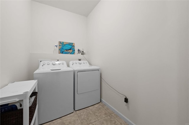 laundry room featuring laundry area, independent washer and dryer, and baseboards