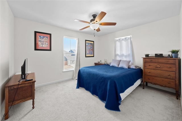 bedroom featuring carpet floors, baseboards, and a ceiling fan