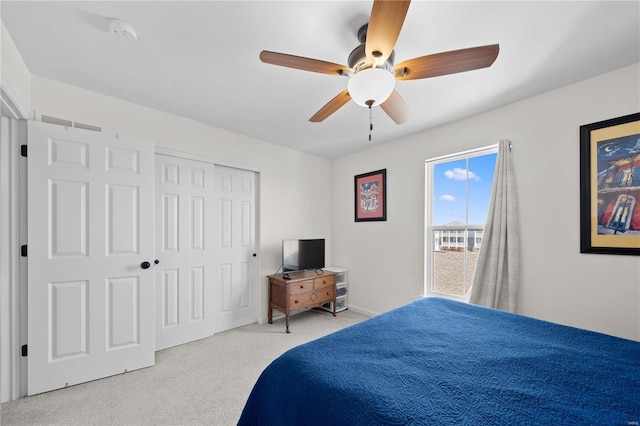 carpeted bedroom featuring visible vents and ceiling fan