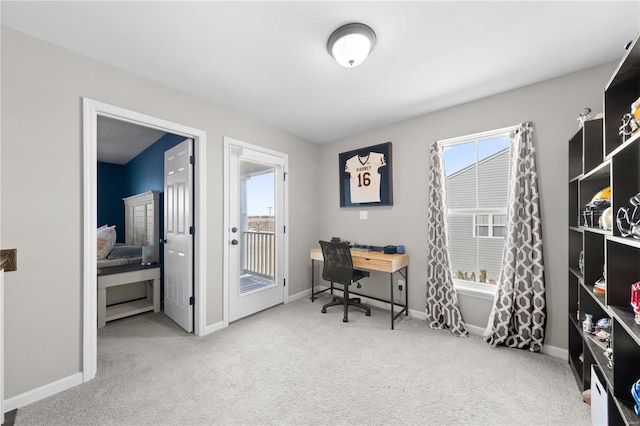 carpeted office featuring baseboards