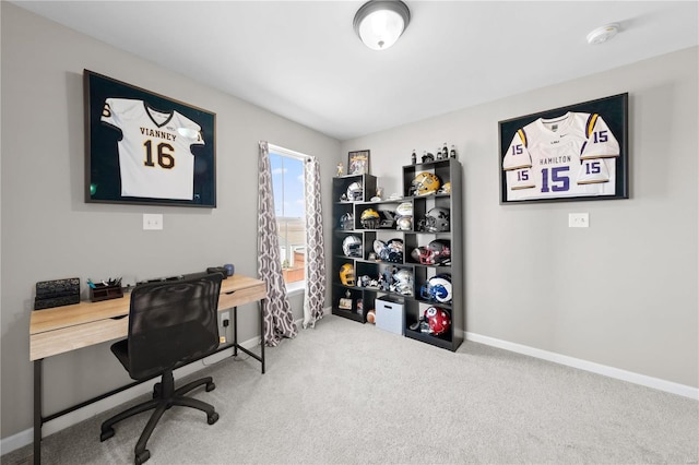 carpeted office space featuring baseboards