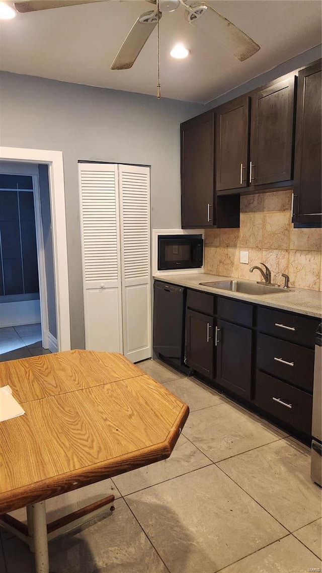 kitchen with decorative backsplash, a ceiling fan, light countertops, black appliances, and a sink