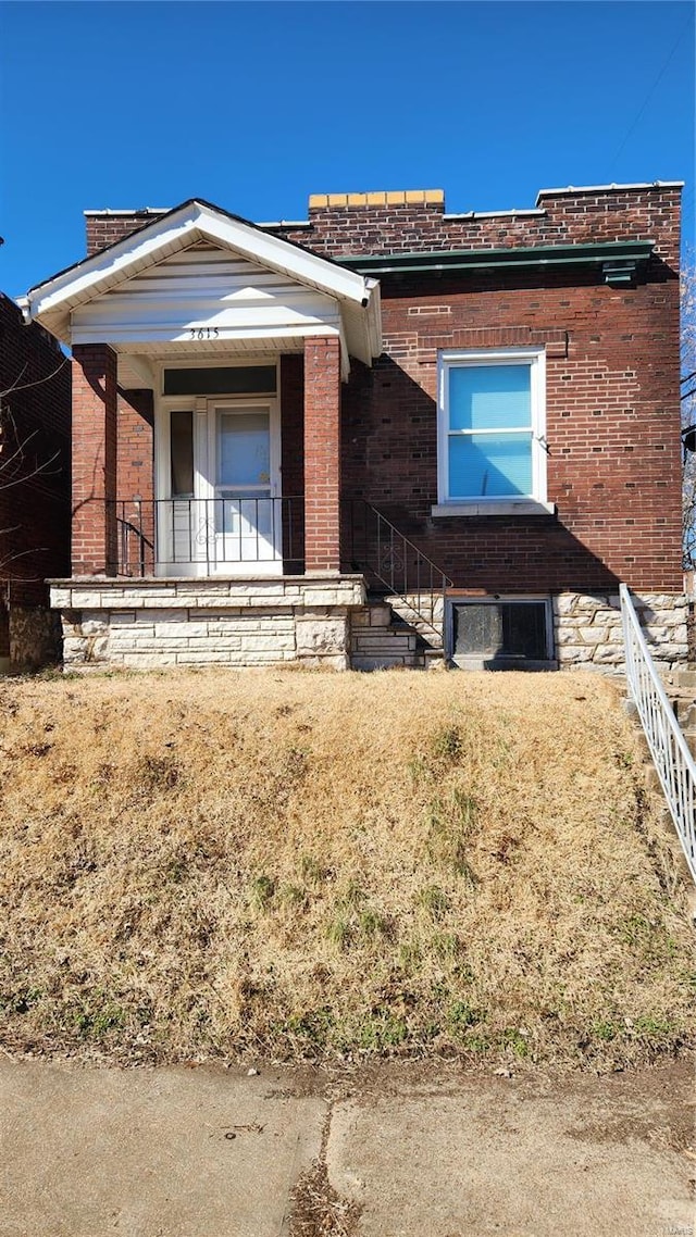 view of front of property featuring brick siding