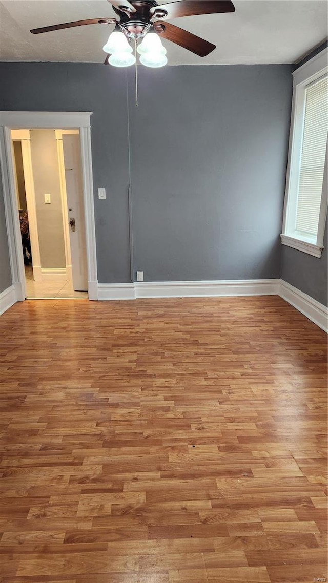 empty room featuring light wood-style floors and baseboards