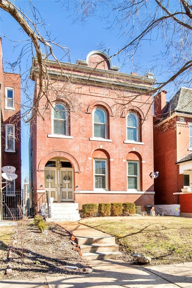 view of front of home with brick siding