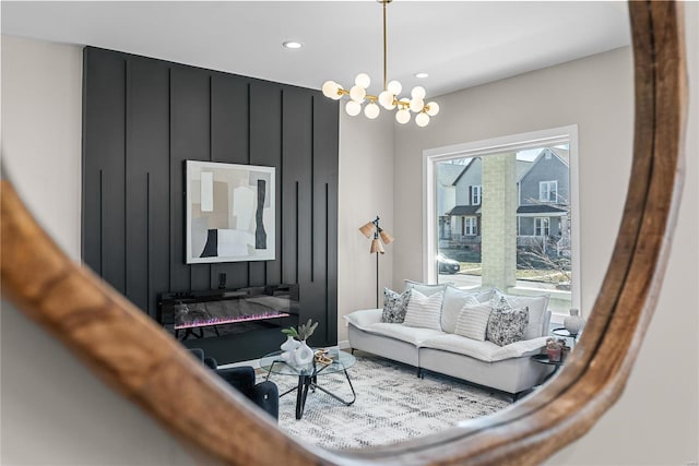 living area with a notable chandelier and recessed lighting