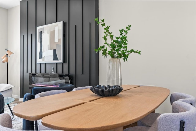 dining room featuring baseboards and wood finished floors