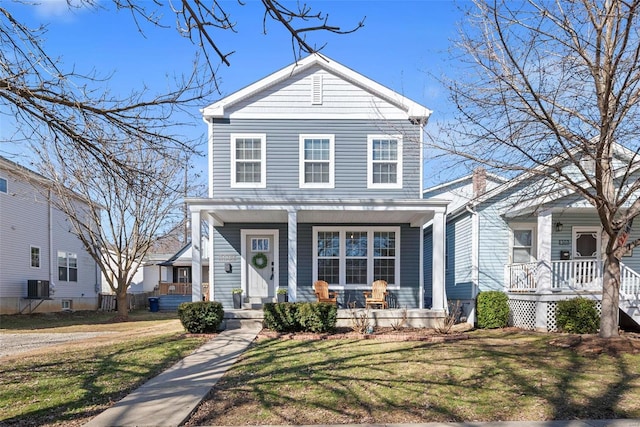 view of front of home with covered porch and a front yard