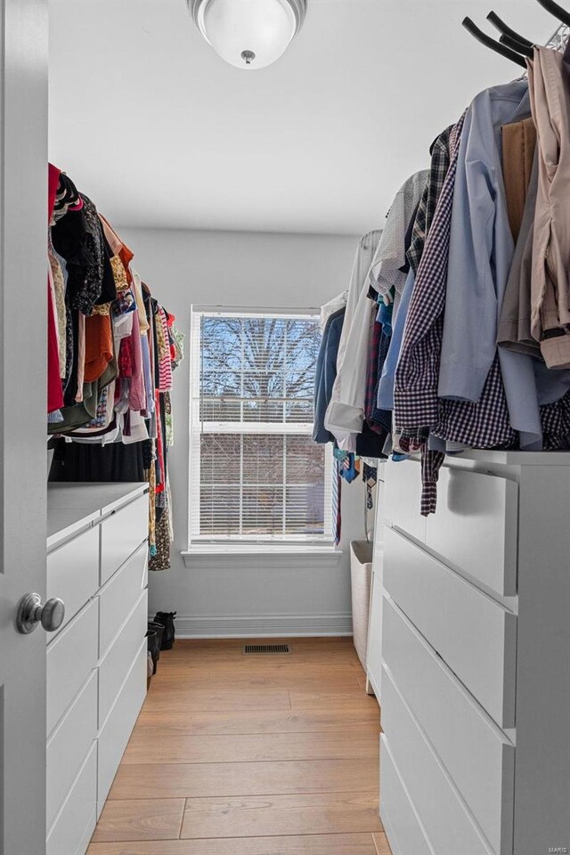 spacious closet featuring light wood finished floors and visible vents