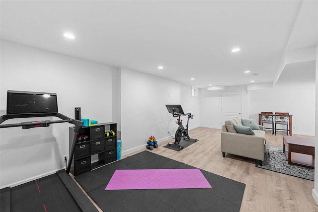 exercise area with recessed lighting, baseboards, and wood finished floors