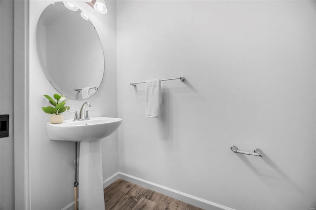 bathroom featuring baseboards and wood finished floors