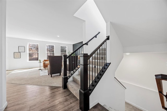 staircase featuring wood finished floors