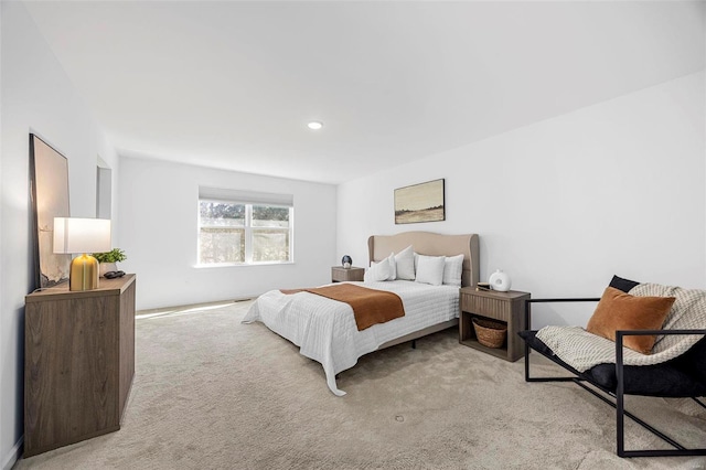 bedroom with recessed lighting and light carpet