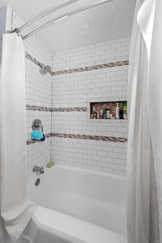 bathroom with shower / bathtub combination with curtain