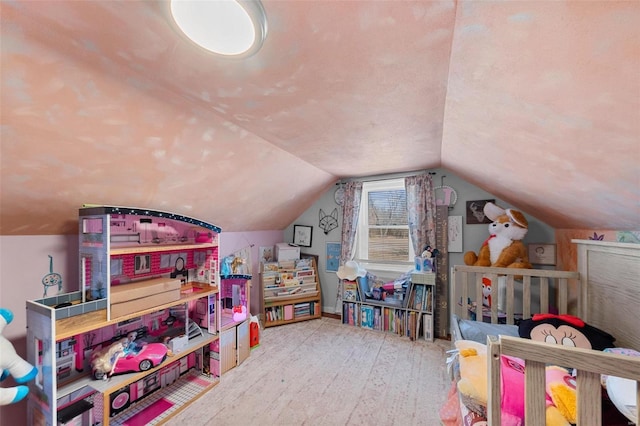 playroom featuring vaulted ceiling and hardwood / wood-style floors