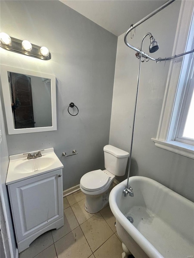 full bath with vanity, a bathtub, tile patterned flooring, and toilet