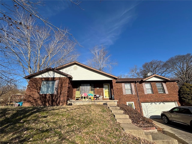 ranch-style home featuring an attached garage, driveway, a front yard, and brick siding