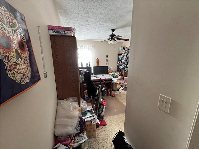 office area featuring ceiling fan and a textured ceiling