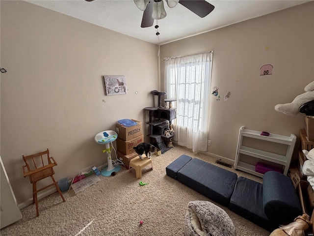 exercise area with carpet and a ceiling fan