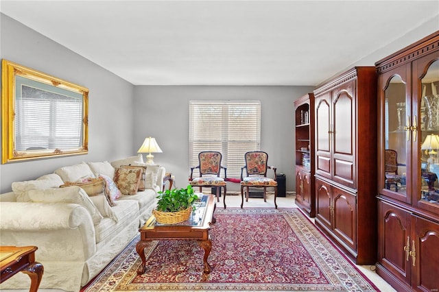 living area featuring light carpet