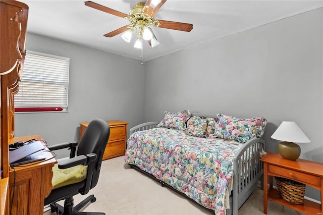 bedroom with light colored carpet and ceiling fan