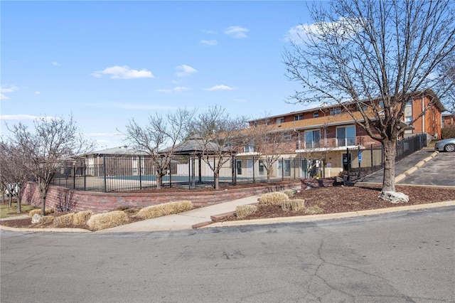 view of building exterior with fence