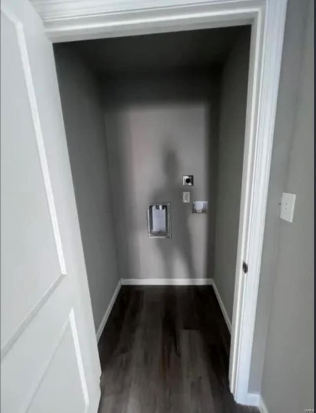 laundry area with dark wood-style flooring, hookup for an electric dryer, and baseboards