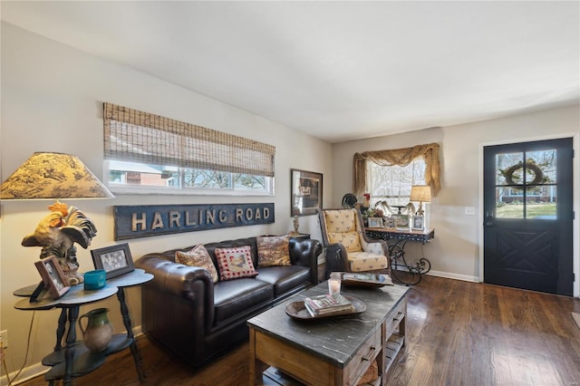 living room with baseboards and dark wood-style flooring