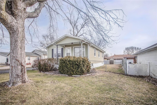 view of home's exterior with a yard and fence