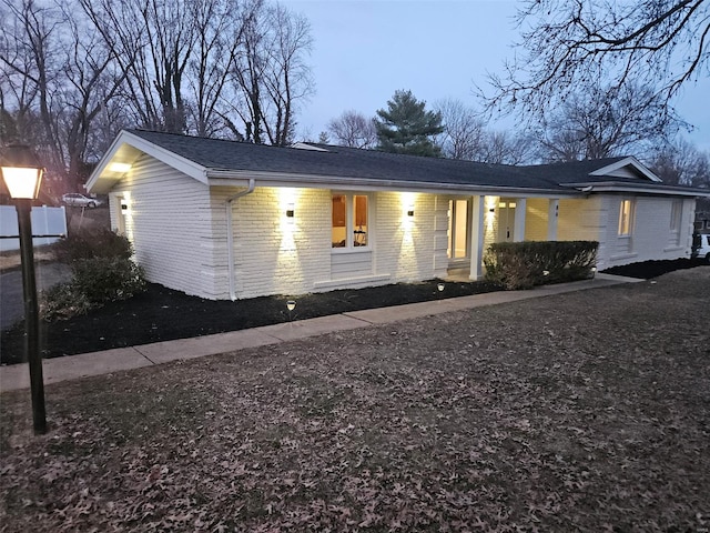 view of front facade featuring brick siding