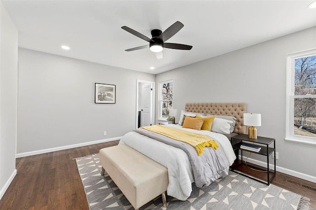 bedroom with recessed lighting, wood finished floors, visible vents, and baseboards