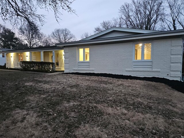 exterior space featuring brick siding