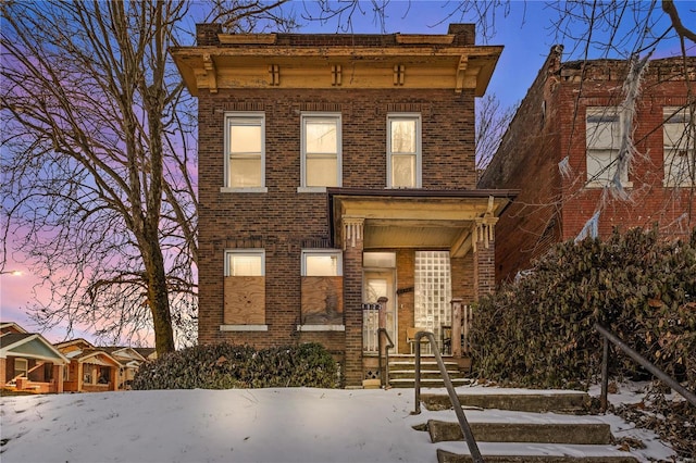 italianate-style house featuring brick siding