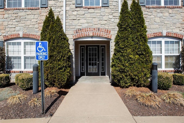 view of exterior entry with stone siding