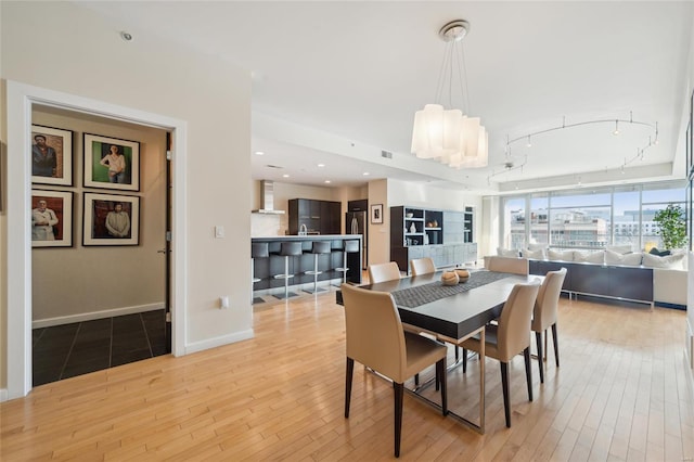 dining area featuring recessed lighting, visible vents, baseboards, light wood-style floors, and track lighting