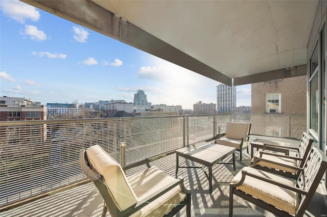 balcony with a view of city and an outdoor living space