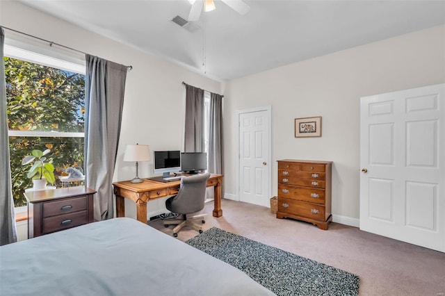 carpeted bedroom featuring visible vents, a ceiling fan, and baseboards