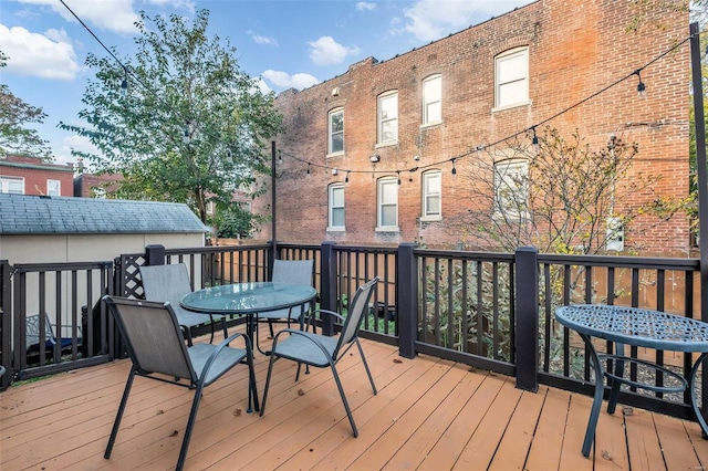 deck featuring outdoor dining area