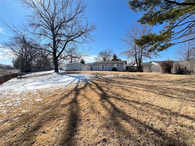 view of front of house featuring fence