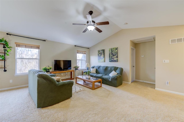 living room featuring visible vents, baseboards, carpet flooring, and vaulted ceiling