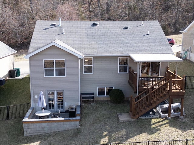 back of house with a patio, fence, a wooden deck, a yard, and stairs