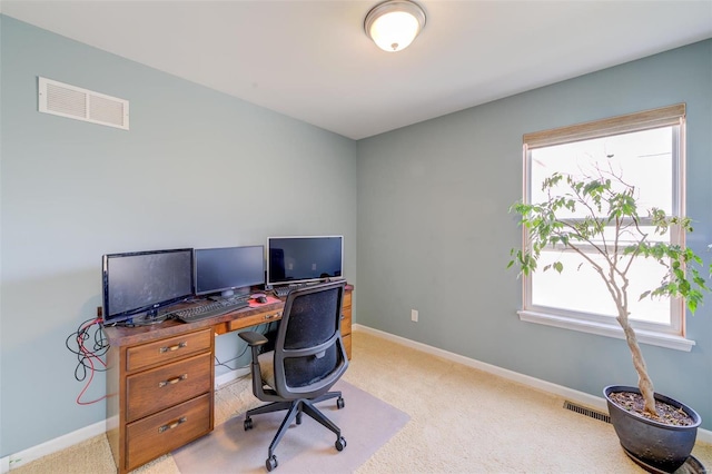 office with visible vents, plenty of natural light, and baseboards