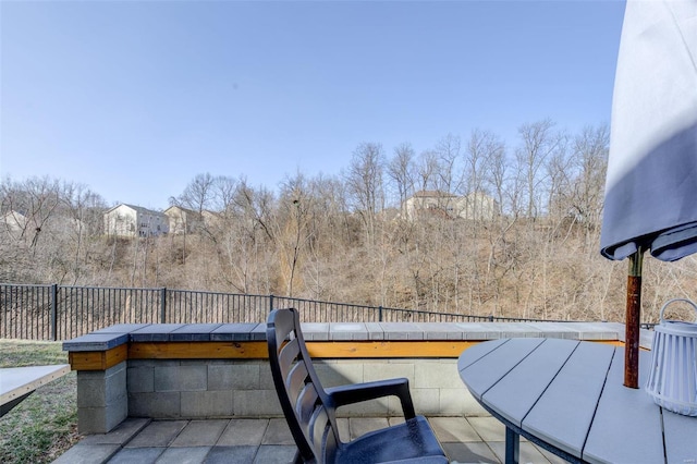 view of patio featuring fence